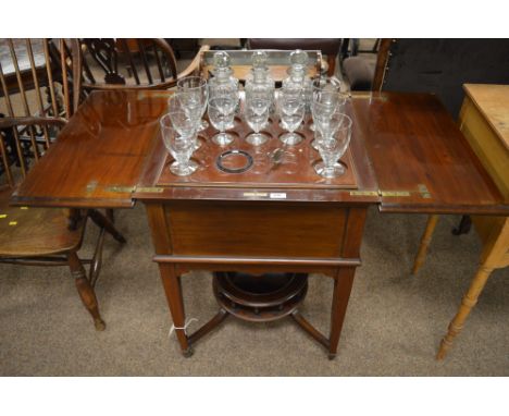 An early 20th century elevette drinks cabinet by Asprey &amp; Co. London, The rectangular and hinged two panel top enclosing 