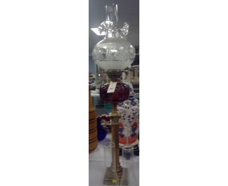 A Victorian Youngs Special Brass and glass duplex oil lamp, the brass corinthian column with ammethyst glass reservoir and cl