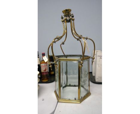 A Victorian brass hexagonal hall lantern, with cut and bevelled panels.