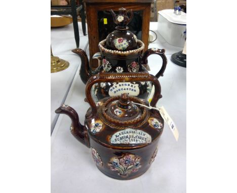 Two Bargeware teapots: one marked R. Chamberlain, Burton on Trent 1888; the other Mrs Rumney, Doncaster 1903.