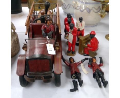 A large model vintage-style fire engine and three firemen; together with a five piece porcelain New Orleans Jazz Band.
