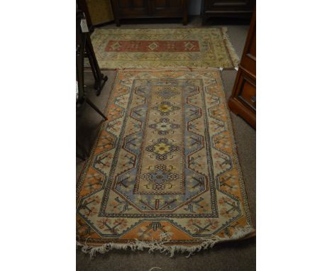 A 20th century Persian carpet with red ground and a row of three medallions contained with in a stylised flower head border 2