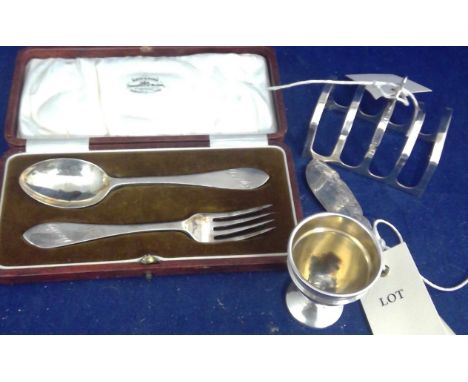 A silver christening spoon and fork, by Charles Perry &amp; Co, Chester 1928, inscribed 'Dorothy', cased; together with an Am