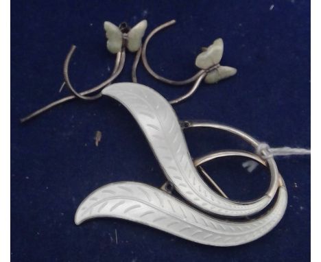 A Norwegian silver and enamel brooch, by Aksel Holmsen, of leaf design; together with a pair of white metal and enamel butter