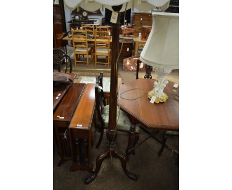 A 20th century mahogany standard lamp, with tapering and fluted baluster turned column, raised on cabriole legs and pad feet 