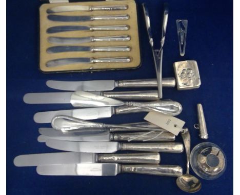 Silver items including: a set of six tea knives with silver filled handles, cased; eight table knives with silver filled hand