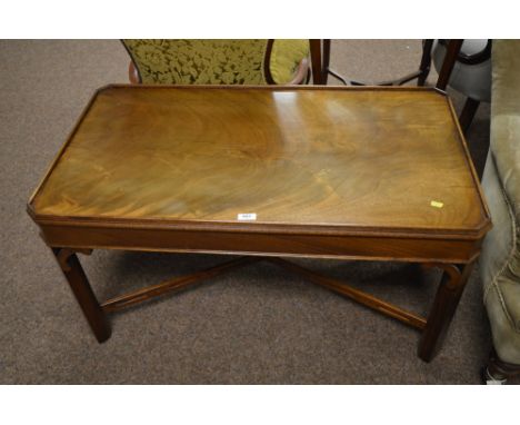 A 20th century mahogany coffee table, in the Chippendale taste, the rectangular top with canted corners and raised moulded ed