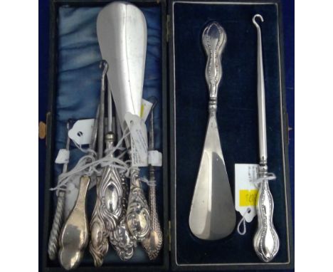 A selection of dressing items with silver filled handles, including: shoe horns and button hooks.