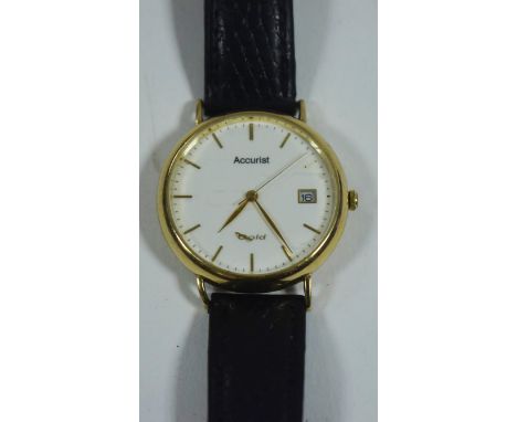 A 9ct yellow gold cased Accurist wristwatch, with baton dial and subsidiary date aperture, on black leather strap.