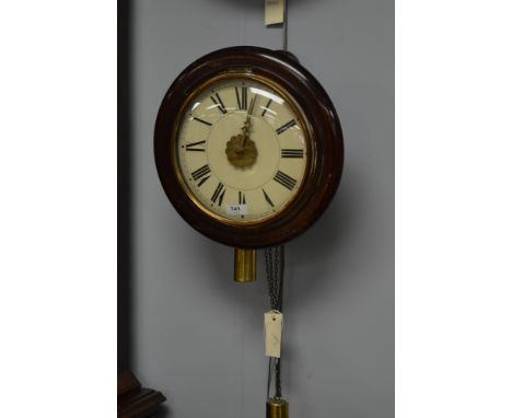 A Victorian Postman's clocks, with enamel dial and roman numerals, the drivetrain movement striking a bell and contained with