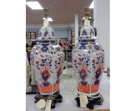 A pair of Chinese style Imari pattern pottery table lamps, 60cms high.