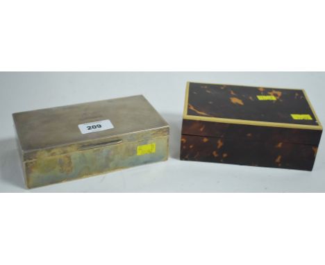 A silver covered cigarette box, the engine turned cover with engraved initials; together with a tortoise shell and box wood c