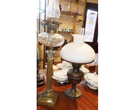 Tall Victorian brass column oil lamp with cut clear glass reservoir and another lamp