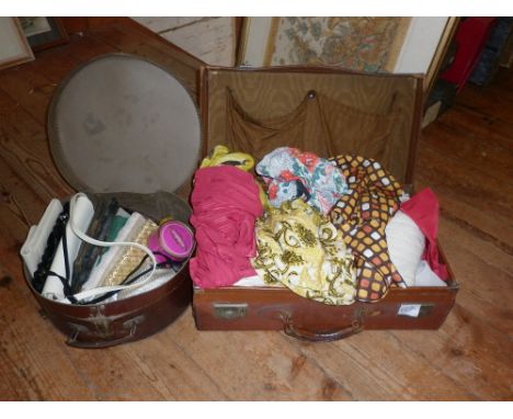 Leather suitcase containing vintage clothing and a hat box of handbags