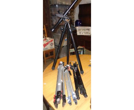 A Benbo camera tripod and three others