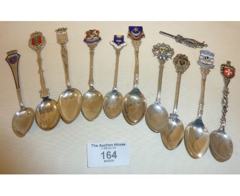 Ten enamel souvenir spoons, some silver