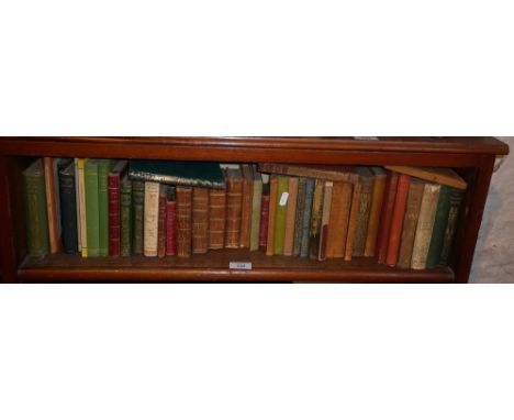 Shelf of assorted old small poetry books