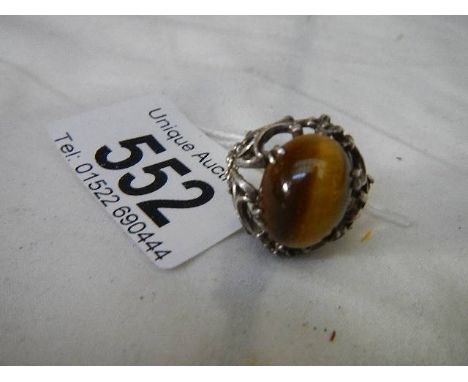 A silver ring set Tiger's eye stone. 