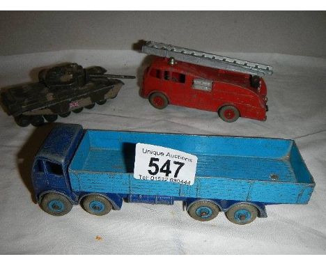 A Dinky Foden lorry, a Dinky fire engine and a Corgi tank. 