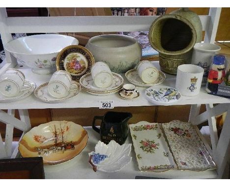 A Royal Doulton bowl, two Old Foley trays, coffee cans with saucers etc., 2 shelves. A box of assorted pub ashtrays. (Collect