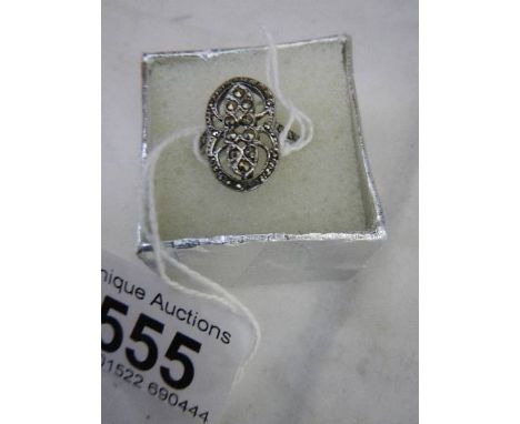 A silver marcasite ring. 