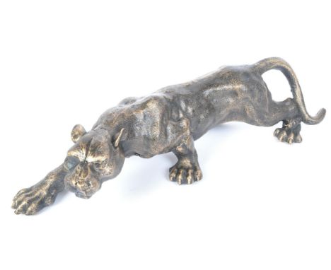 A retro vintage 20th Century moulded brass figure of a wild big cat Panther / Puma / Jaguar. In prowling position with paws o