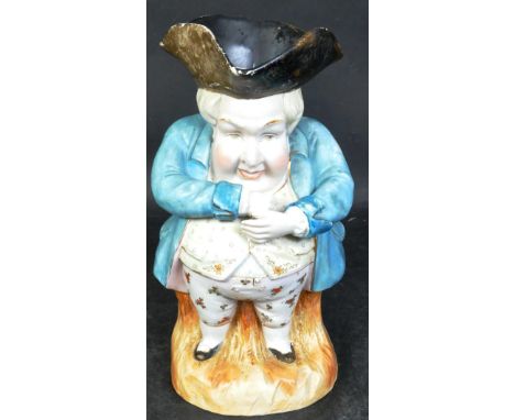 A 19th century and later Victorian bone china character jug. The character being modelled wearing a tricorn hat with pale blu