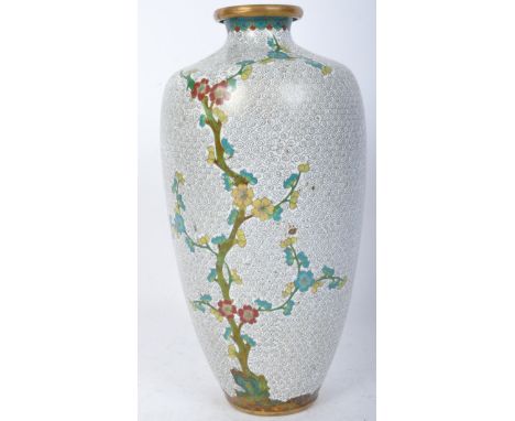 A 20th Century Chinese white cloisonné vase. Having a gilt rimmed top, with white ground enamel decorated in prunus leaves. M
