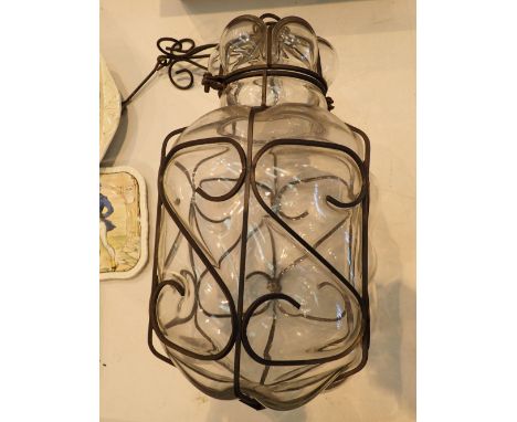 Large blown glass light shade with wrought metal frame