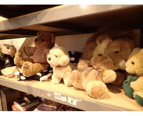 Shelf of plush toys including teddy bears dogs etc