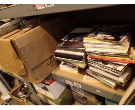 Shelf of maps prints CDs books etc