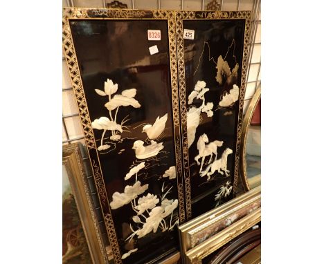 Two lacquered wall hanging panels with mother of pearl birds and flowers 
