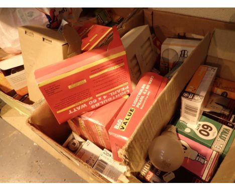 Two boxes of light bulbs and candles