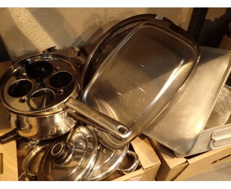 Shelf of mixed stainless steel and other metal cook and kitchenware