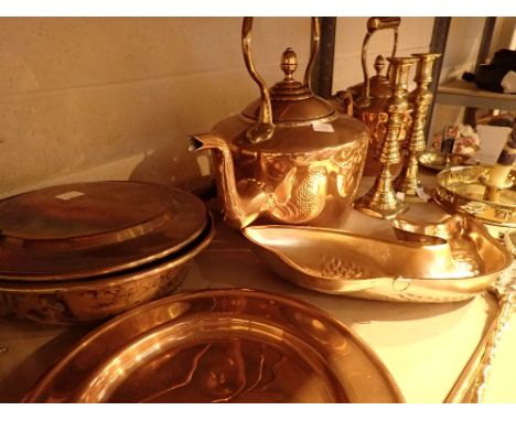 Shelf of brass and copper items including two kettles candlesticks bed warmer etc