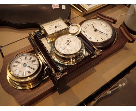 Selection of clocks and a barometer 