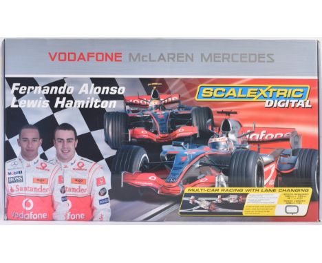 An original Hornby made digital Scalextric slot car racing set No. C1214 Formula One / F1 Alonso &amp; Hamilton set. The set 