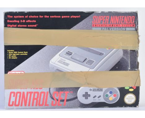 Retro Gaming - a vintage 1990s SNES Super Nintendo Entertainment System video game console with x2 controllers, Kevin Keegan 