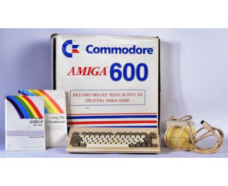 Retro Gaming - a vintage 1990s (1992) Commodore Amiga 600 Series home computer. Contains the computer, power supply, introduc
