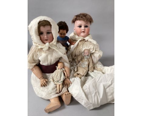 Antique dolls to include 2 German bisque headed dolls -One doll 22” tall is on an unrelated French Jumeau body with blue labe