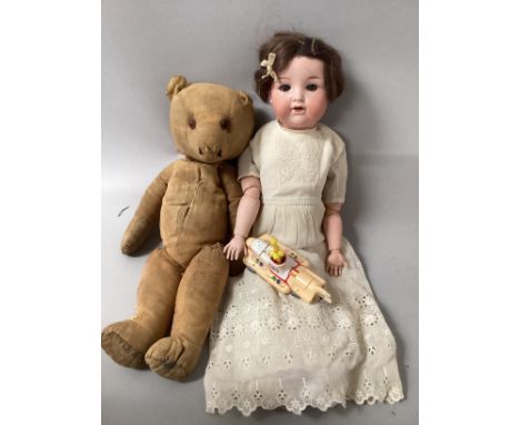 Box of old toys to include a Marseille 990 bisque head doll c 16” and an old pre war teddy bear a/f and a corgi yellow Beatle