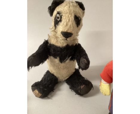 Merrythought Registered Panda 1931 Design No.821561, with black and white mohair, clear and black glass eye and the other is 