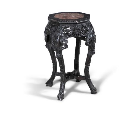 A CHINESE PADOUK AND ROUGUE MARBLE OCTAGONAL JARDINIERE STAND,the platform top with beaded edge and pierced carved aprons, on