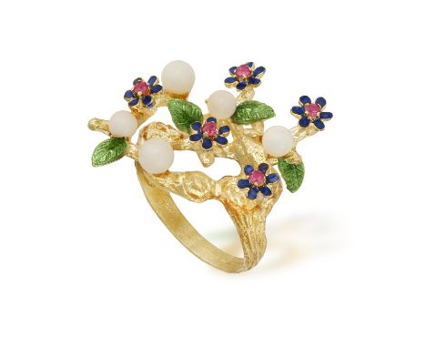 A FLOWER RING, of foliate design with enamel accented with circular-cut red stones, to a textured gold hoop, mounted in 18K g