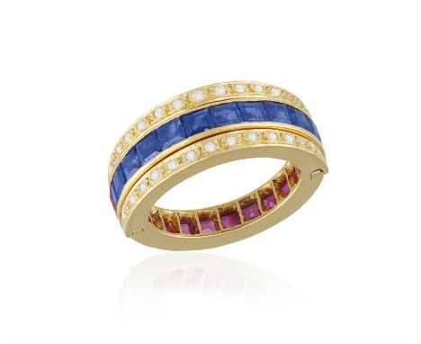 A SAPPHIRE, RUBY AND DIAMOND FLIP RING, the central hoop set with calibré-cut sapphires and rubies, with diamond-set flipping