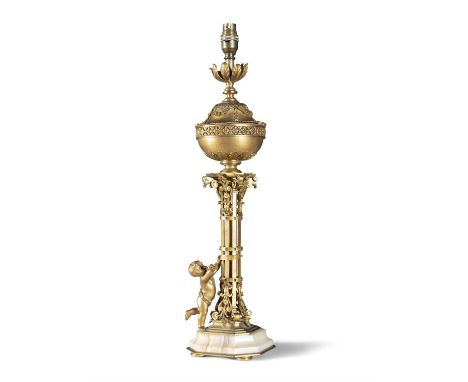A FRENCH ORMOLU OIL LAMP, 19TH CENTURY In the form of a baluster reservoir atop a naturalist column with attendant putti hold