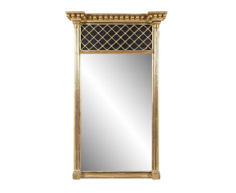 A REGENCY GILTWOOD PIER MIRROR,of upright rectangular form, fitted with plain glass plate, below a blind grill segment and a 