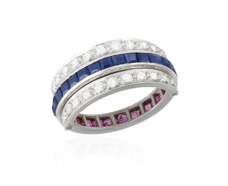 A SAPPHIRE, RUBY AND DIAMOND FLIP RING, the central hoop set with calibré-cut sapphires and rubies, with diamond-set flipping