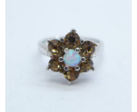 A cluster dress ring with synthetic opal and cognac coloured crystal, N 