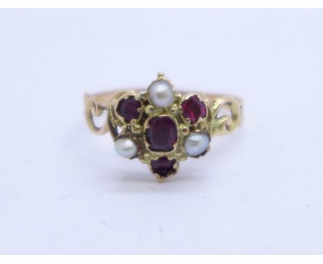 A Victorian yellow metal, pearl and red stone cluster ring, (tests as gold), 1.6g, O 